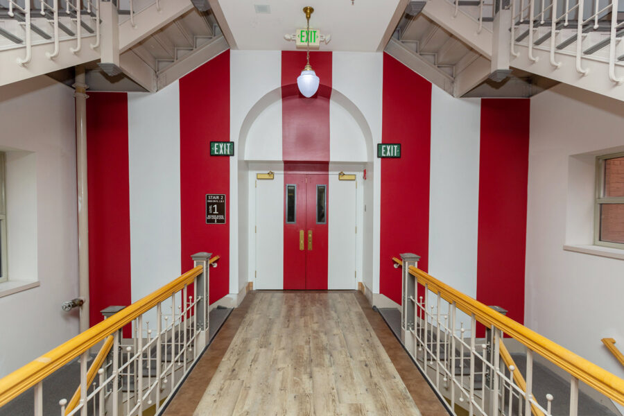 Grand staircase wall painted in red and white IU "candy stripes"